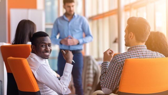 Business meeting in a modern office with young people .